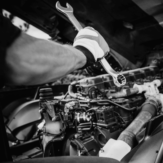 mechanic repairing a truck engine
