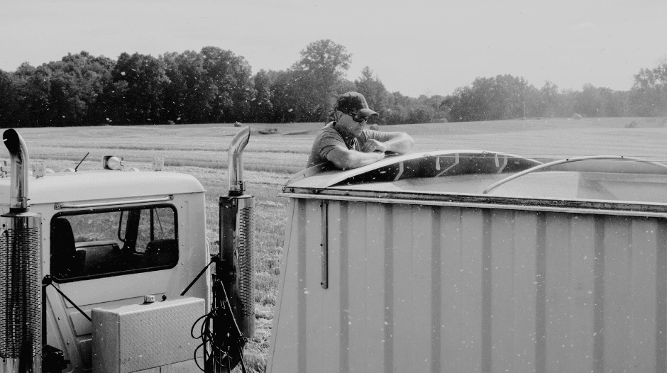 a truck driver on the side of the road