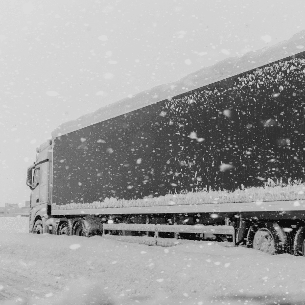 semi truck driving in the winter