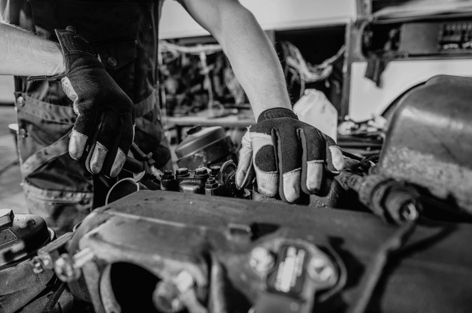 a mechanic repairing a truck engine