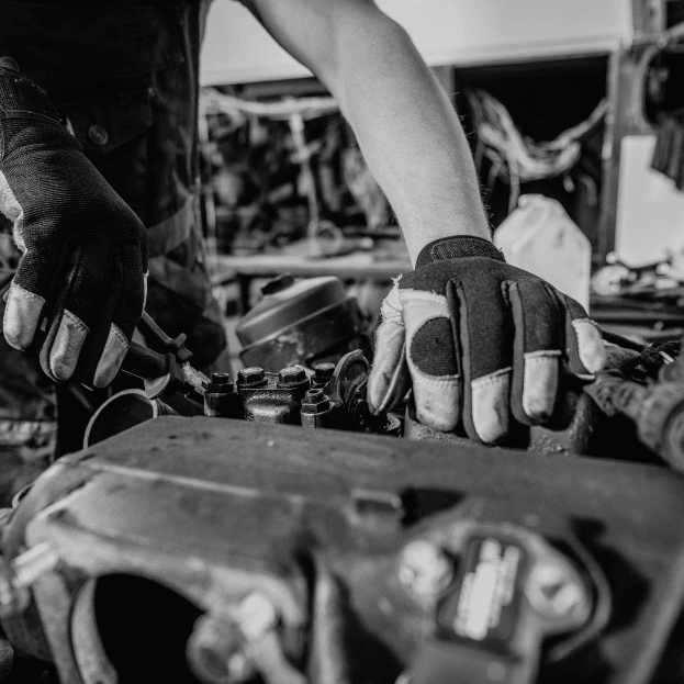 mechanic repairing a truck engine