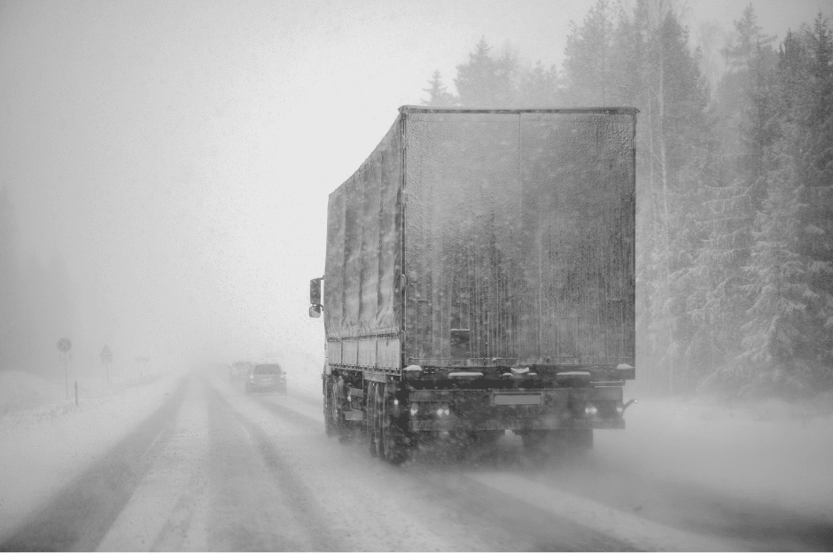 truck driving in the winter snow